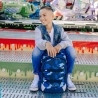 NEOXX Schulrucksack Active Pro Camo nation mit Kind sitzend
